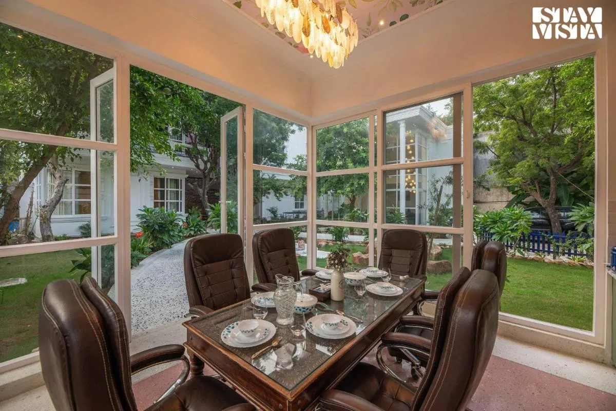 Image 3 of StayVista’s Indraj Manor – Roman-Inspired Villa with Posh Interiors, Mesmerizing Garden & Outdoor Fireplace